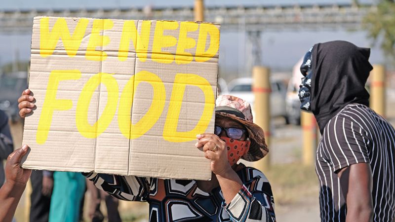 A protester holds a sign